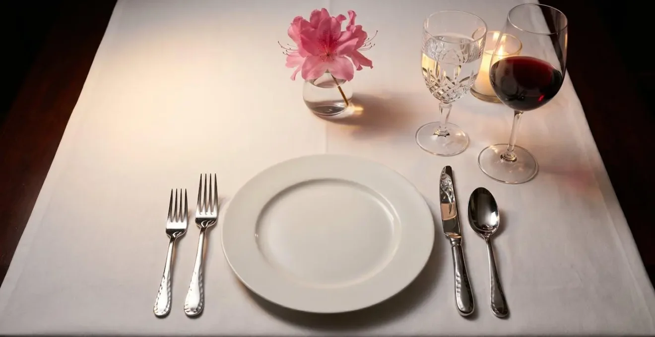 Elegant table setting with classic glassware and silverware representing the exclusive Masters Champions Dinner tradition