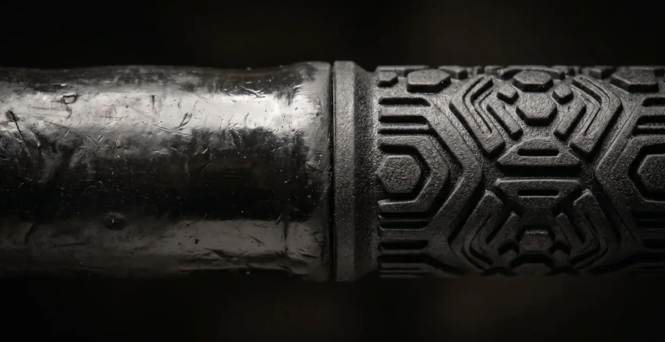 Extreme close-up showing the texture difference between worn and new golf grip surfaces