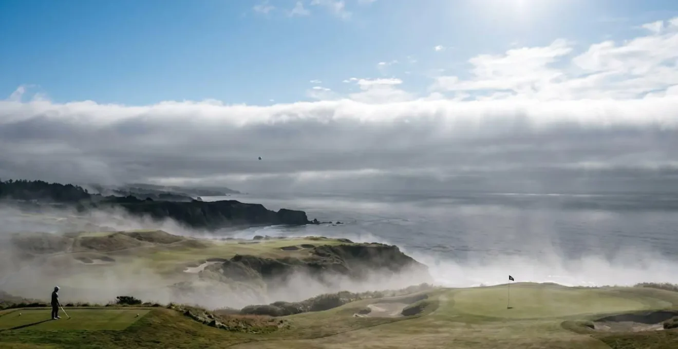 Cross-section view showing temperature inversion layer trapping cool air over coastal golf course